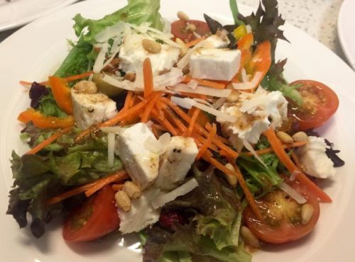 Healthy salad with Mozzarella, Feta, pine nuts and raspberry balsamic vinaigrette